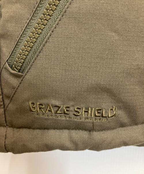 GRIP SWANY（グリップスワニー）GRIP SWANY (グリップスワニー) ファイアプルーフダウンジャケット カーキ サイズ:Lの古着・服飾アイテム