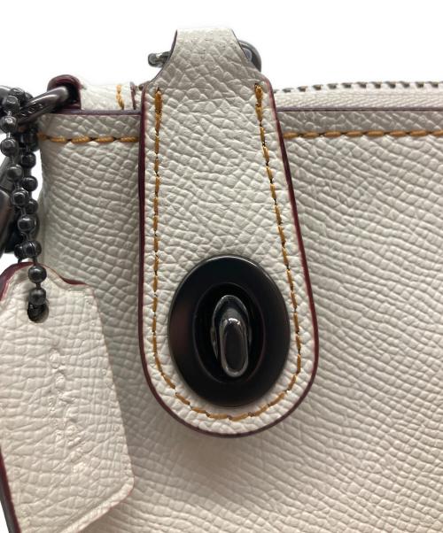 COACH（コーチ）COACH (コーチ) クラッチバッグ ベージュの古着・服飾アイテム