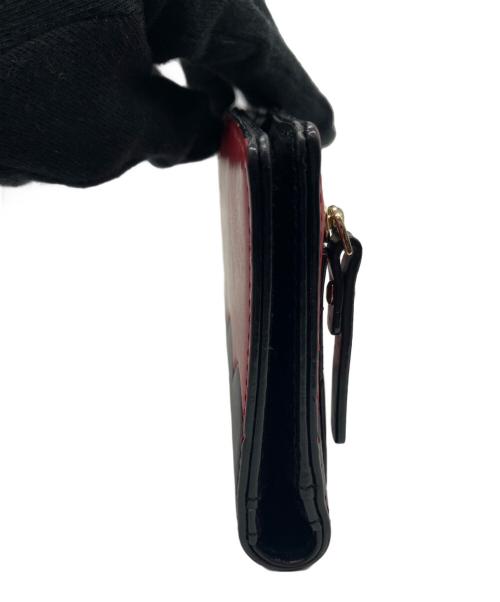 Kate Spade（ケイトスペード）Kate Spade (ケイトスペード) 2つ折り長財布 レッド×ブラックの古着・服飾アイテム