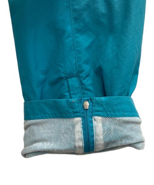 Champion（チャンピオン）Champion (チャンピオン) UNDEFEATED (アンディフィーテッド) ナイロンパンツ ブルー サイズ:XLの古着・服飾アイテム