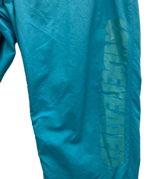 Champion（チャンピオン）Champion (チャンピオン) UNDEFEATED (アンディフィーテッド) ナイロンパンツ ブルー サイズ:XLの古着・服飾アイテム