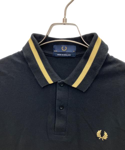 FRED PERRY（フレッドペリー）FRED PERRY (フレッドペリー) ポロシャツ ブラック×イエロー サイズ:SIZE 42の古着・服飾アイテム