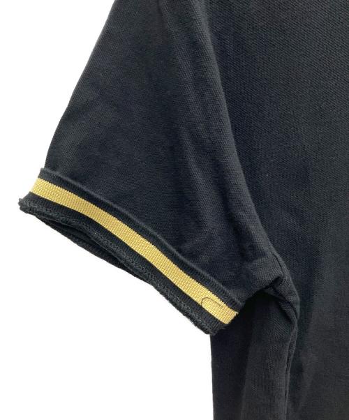 FRED PERRY（フレッドペリー）FRED PERRY (フレッドペリー) ポロシャツ ブラック×イエロー サイズ:SIZE 42の古着・服飾アイテム