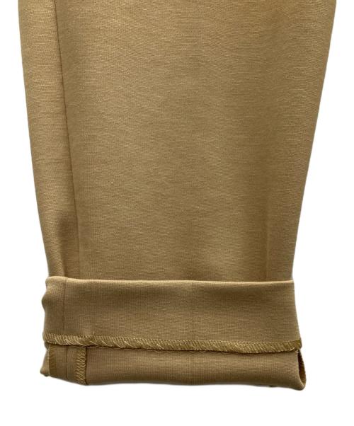 LACOSTE（ラコステ）LACOSTE (ラコステ) センタープレスパンツ ベージュ サイズ:SIZE34 未使用品の古着・服飾アイテム