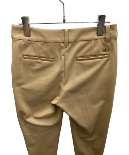 LACOSTE（ラコステ）LACOSTE (ラコステ) センタープレスパンツ ベージュ サイズ:SIZE34 未使用品の古着・服飾アイテム