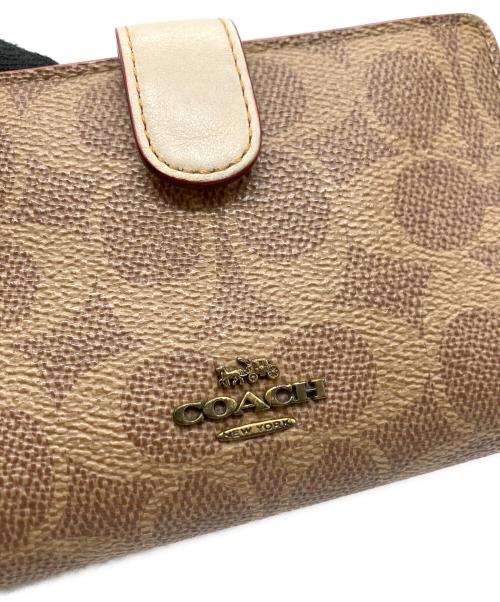 COACH（コーチ）COACH (コーチ) 2つ折り財布 ベージュの古着・服飾アイテム