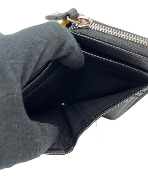 DIESEL（ディーゼル）DIESEL (ディーゼル) 2つ折り財布 イエローの古着・服飾アイテム