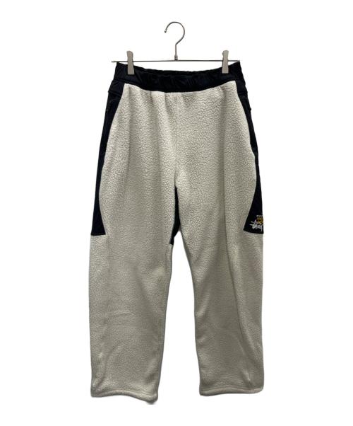 stussy（ステューシー）stussy (ステューシー) MOUNTAIN HARD WEAR (マウンテンハードウェア) ボアパンツ アイボリー×ブラック サイズ:SIZE Mの古着・服飾アイテム