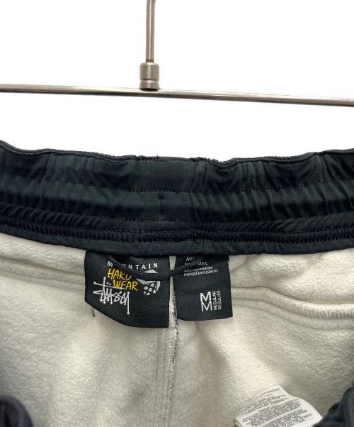 stussy（ステューシー）stussy (ステューシー) MOUNTAIN HARD WEAR (マウンテンハードウェア) ボアパンツ アイボリー×ブラック サイズ:SIZE Mの古着・服飾アイテム