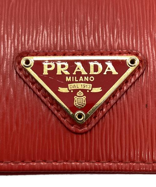 PRADA（プラダ）PRADA (プラダ) カードケース 三角プレート レッドの古着・服飾アイテム