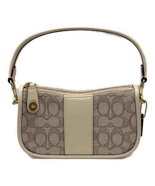 COACH（コーチ）COACH (コーチ) シグネチャー スウィンガー  ベージュの古着・服飾アイテム