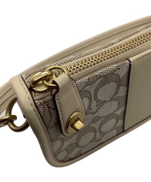 COACH（コーチ）COACH (コーチ) シグネチャー スウィンガー  ベージュの古着・服飾アイテム
