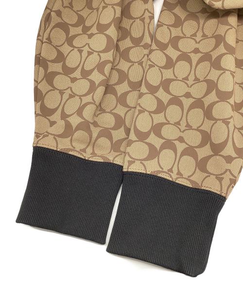 COACH（コーチ）COACH (コーチ) ジップパーカー シグネチャー ベージュ×ブラック サイズ:Mの古着・服飾アイテム