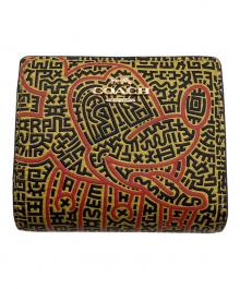 COACH×DISNEY×Keith Haring（コーチ×ディズニー×キースヘリング）の古着「2つ折り財布」｜イエロー