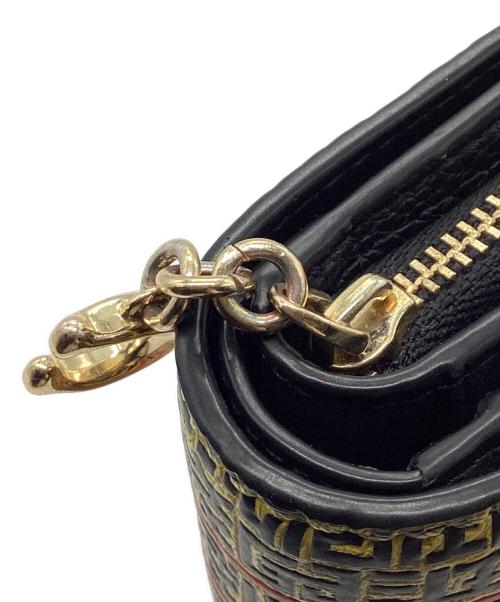 COACH（コーチ）COACH (コーチ) DISNEY (ディズニー) Keith Haring (キースヘリング) 2つ折り財布 イエローの古着・服飾アイテム