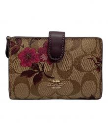 COACH（コーチ）の古着「2つ折り財布　シグネチャー」｜ブラウン