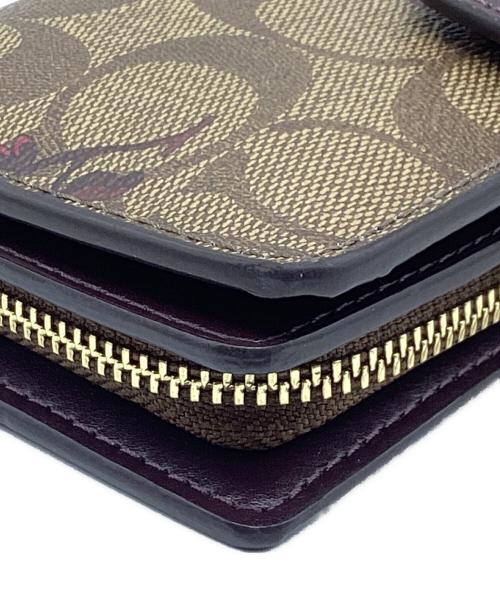 COACH（コーチ）COACH (コーチ) 2つ折り財布　シグネチャー ブラウンの古着・服飾アイテム