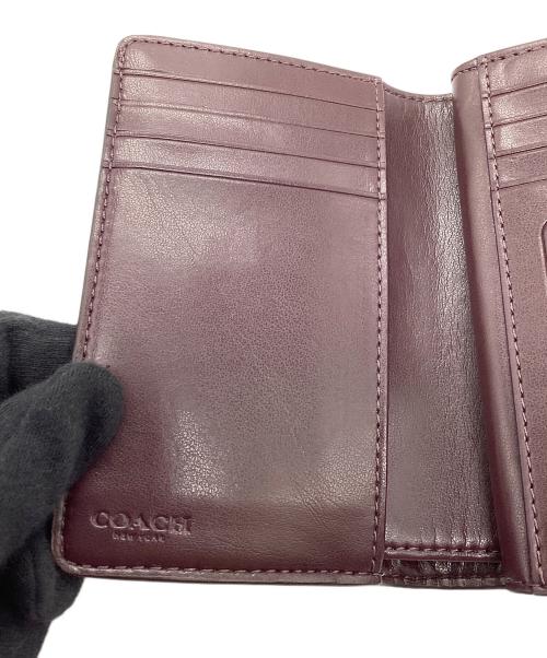 COACH（コーチ）COACH (コーチ) 2つ折り財布　シグネチャー ブラウンの古着・服飾アイテム