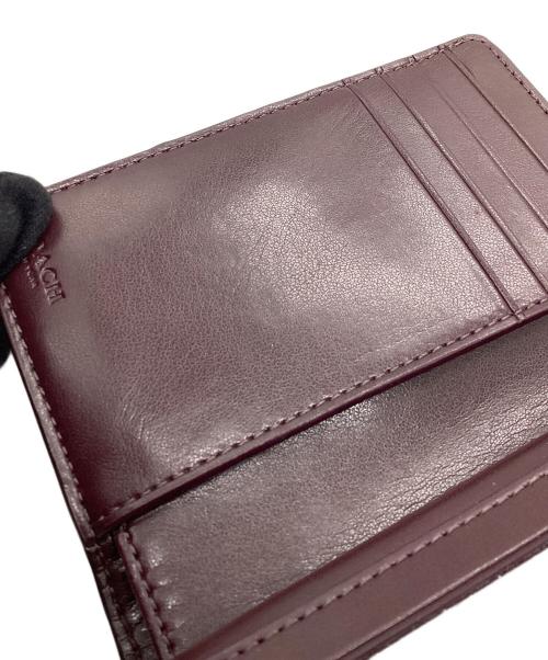 COACH（コーチ）COACH (コーチ) 2つ折り財布　シグネチャー ブラウンの古着・服飾アイテム