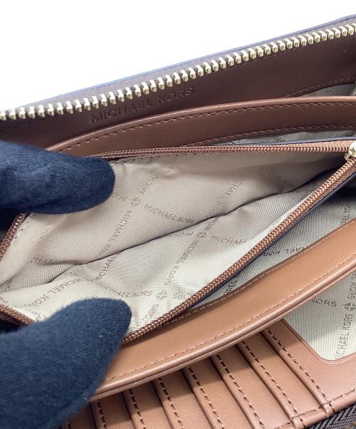 MICHAEL KORS（マイケルコース）MICHAEL KORS (マイケルコース) ラウンドファスナー財布 ブラウンの古着・服飾アイテム
