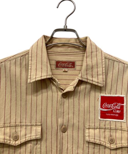 Coca Cola（コカコーラ）Coca Cola (コカコーラ) 長袖シャツ ベージュ サイズ:Lの古着・服飾アイテム