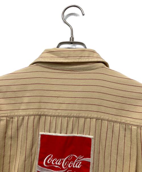 Coca Cola（コカコーラ）Coca Cola (コカコーラ) 長袖シャツ ベージュ サイズ:Lの古着・服飾アイテム