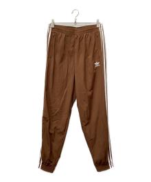 adidas（アディダス）の古着「アディカラー ウーブン ファイヤーバードトラックパンツ」｜ブラウン