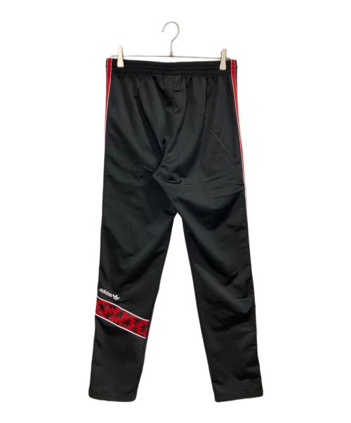 adidas（アディダス）adidas (アディダス) マンチェスター・ユナイテッド '91 トラックパンツ ブラック×レッド サイズ:XLの古着・服飾アイテム