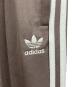 中古・古着 adidas (アディダス) アディカラー バギーフィット ファイヤーバードトラックパンツ ブラウン サイズ:2XL：6000円