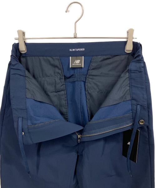 NEW BALANCE（ニューバランス）NEW BALANCE (ニューバランス) スリムテーパードパンツ ネイビー サイズ:L 未使用品の古着・服飾アイテム