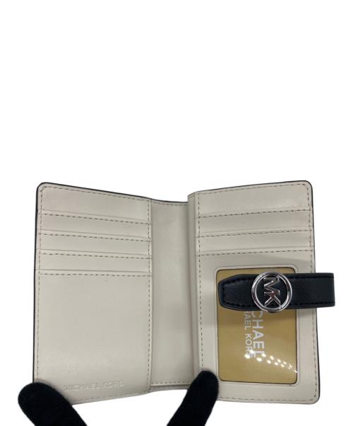 MICHAEL KORS（マイケルコース）MICHAEL KORS (マイケルコース) グリニッジ 2つ折り財布 グレーの古着・服飾アイテム