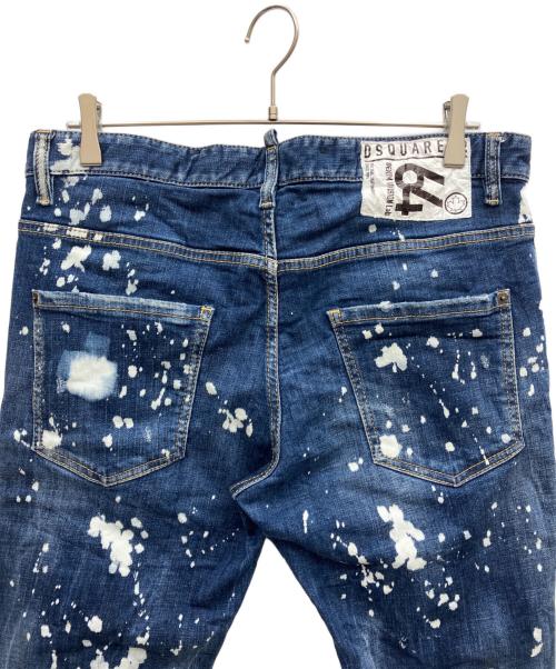 DSQUARED2（ディースクエアード）DSQUARED2 (ディースクエアード) ペイント加工・バックロゴパッチ・フロントロゴタグ付きスプラッシュクラッシュデニム インディゴ サイズ:52の古着・服飾アイテム
