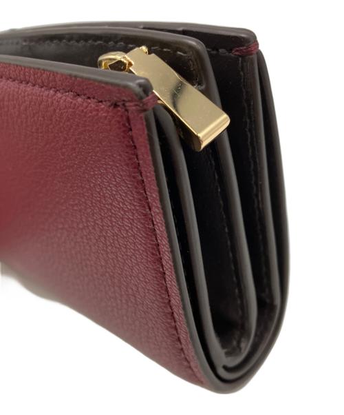MICHAEL KORS（マイケルコース）MICHAEL KORS (マイケルコース) 2つ折り財布 レッドの古着・服飾アイテム