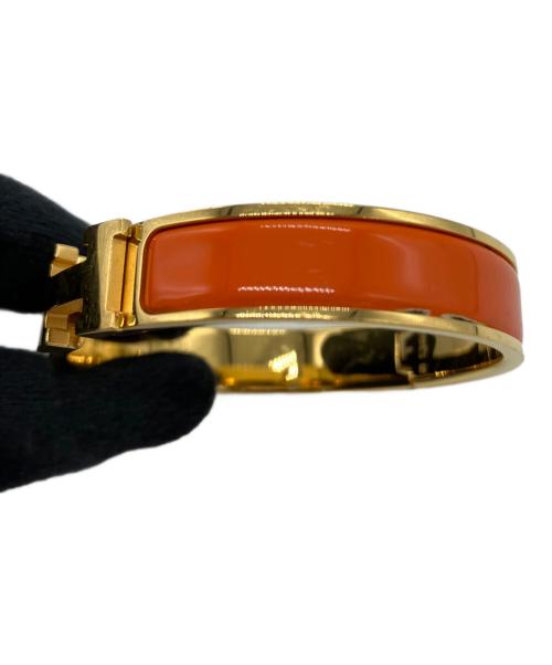 HERMES（エルメス）HERMES (エルメス) バングル オレンジ×ゴールドカラーの古着・服飾アイテム