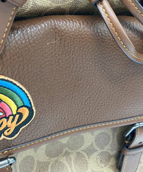 COACH（コーチ）COACH (コーチ) PEANUTS (ピーナッツ) プリント バックパック ブラウンの古着・服飾アイテム