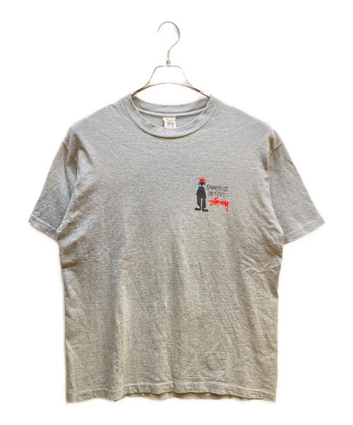 stussy（ステューシー）stussy (ステューシー) knowledge is king シャドーマン Tシャツ グレー サイズ:XLの古着・服飾アイテム