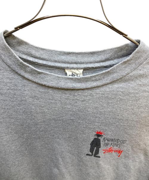 stussy（ステューシー）stussy (ステューシー) knowledge is king シャドーマン Tシャツ グレー サイズ:XLの古着・服飾アイテム