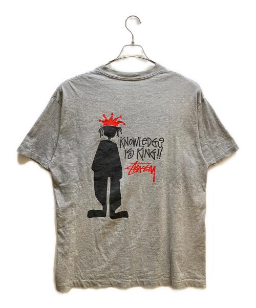 stussy（ステューシー）stussy (ステューシー) knowledge is king シャドーマン Tシャツ グレー サイズ:XLの古着・服飾アイテム
