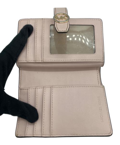 MICHAEL KORS（マイケルコース）MICHAEL KORS (マイケルコース) 2つ折り財布 ピンクの古着・服飾アイテム