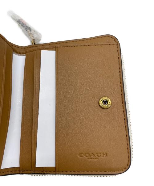 COACH（コーチ）COACH (コーチ) 2つ折り財布 ビルフォールドウォレット  アイボリーの古着・服飾アイテム