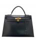 HERMES（エルメス）の古着「ケリー32 外縫い」｜ブラック×ゴールド金具