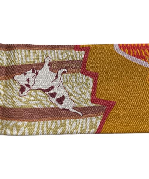 HERMES（エルメス）HERMES (エルメス) ツィリー/EN LIBERTE（自由に） オレンジ×ピンクの古着・服飾アイテム