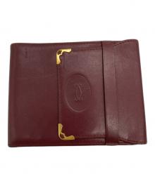 Cartier（カルティエ）の古着「3つ折り財布」｜ボルドー×ゴールド