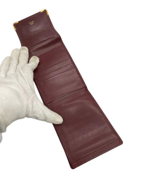 Cartier（カルティエ）Cartier (カルティエ) 3つ折り財布 ボルドー×ゴールドの古着・服飾アイテム