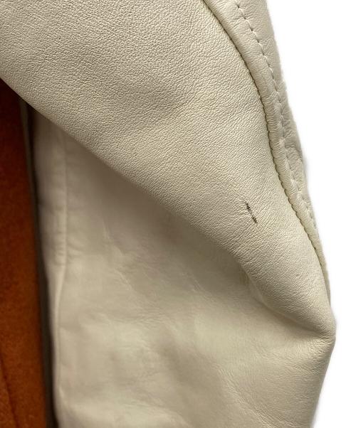 SEVESKIG（セヴシグ）SEVESKIG (セヴシグ) ドンキーカラースタジャン オレンジ×アイボリー サイズ:ｍの古着・服飾アイテム