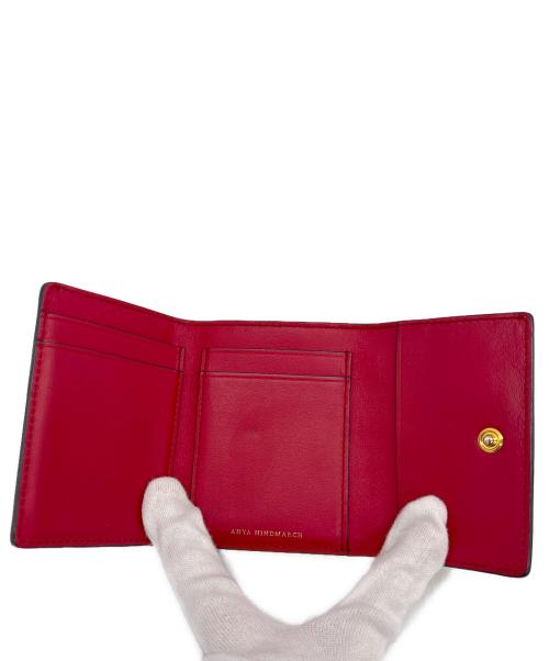 ANYA HINDMARCH（アニヤ・ハインドマーチ）ANYA HINDMARCH (アニヤ・ハインドマーチ) 3つ折り財布 オレンジの古着・服飾アイテム