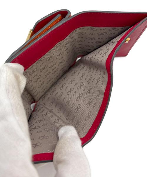 ANYA HINDMARCH（アニヤ・ハインドマーチ）ANYA HINDMARCH (アニヤ・ハインドマーチ) 3つ折り財布 オレンジの古着・服飾アイテム