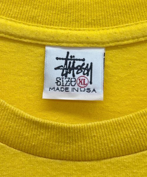 stussy（ステューシー）stussy (ステューシー) シャドーマンプリントTシャツ イエロー サイズ:XLの古着・服飾アイテム