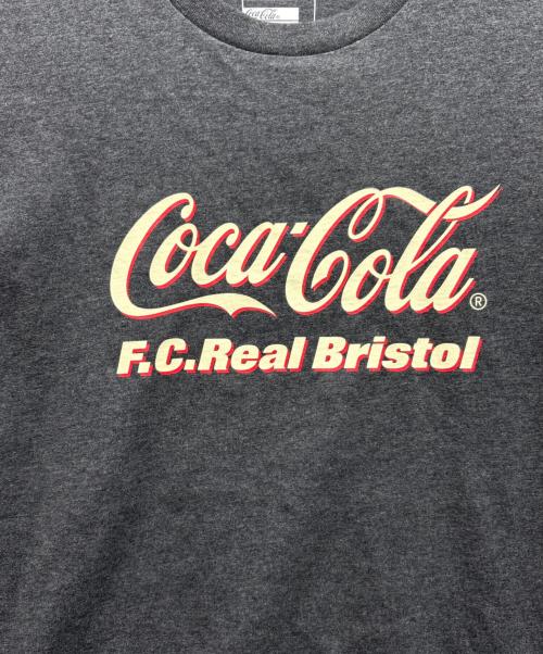 F.C.R.B.（エフシーレアルブリストル）F.C.R.B. (エフシーレアルブリストル) Coca Cola (コカコーラ) Coca-Cola HEATHER TEE ブラック サイズ:L 未使用品の古着・服飾アイテム