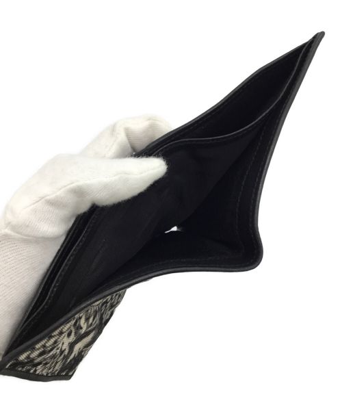 GUCCI（グッチ）GUCCI (グッチ) 2つ折り財布 ホワイト×ブラックの古着・服飾アイテム